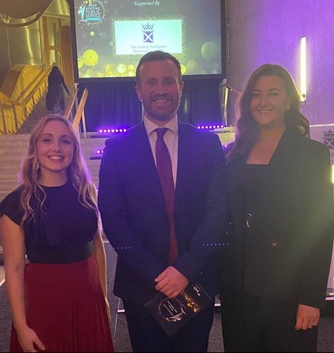 Emma Brannigan-McQueen, from Whocares?Scotland, stands next to Sam Curran of the Scottish Police Authority who stands next to Lynsey Emery of Whocares?Scotland