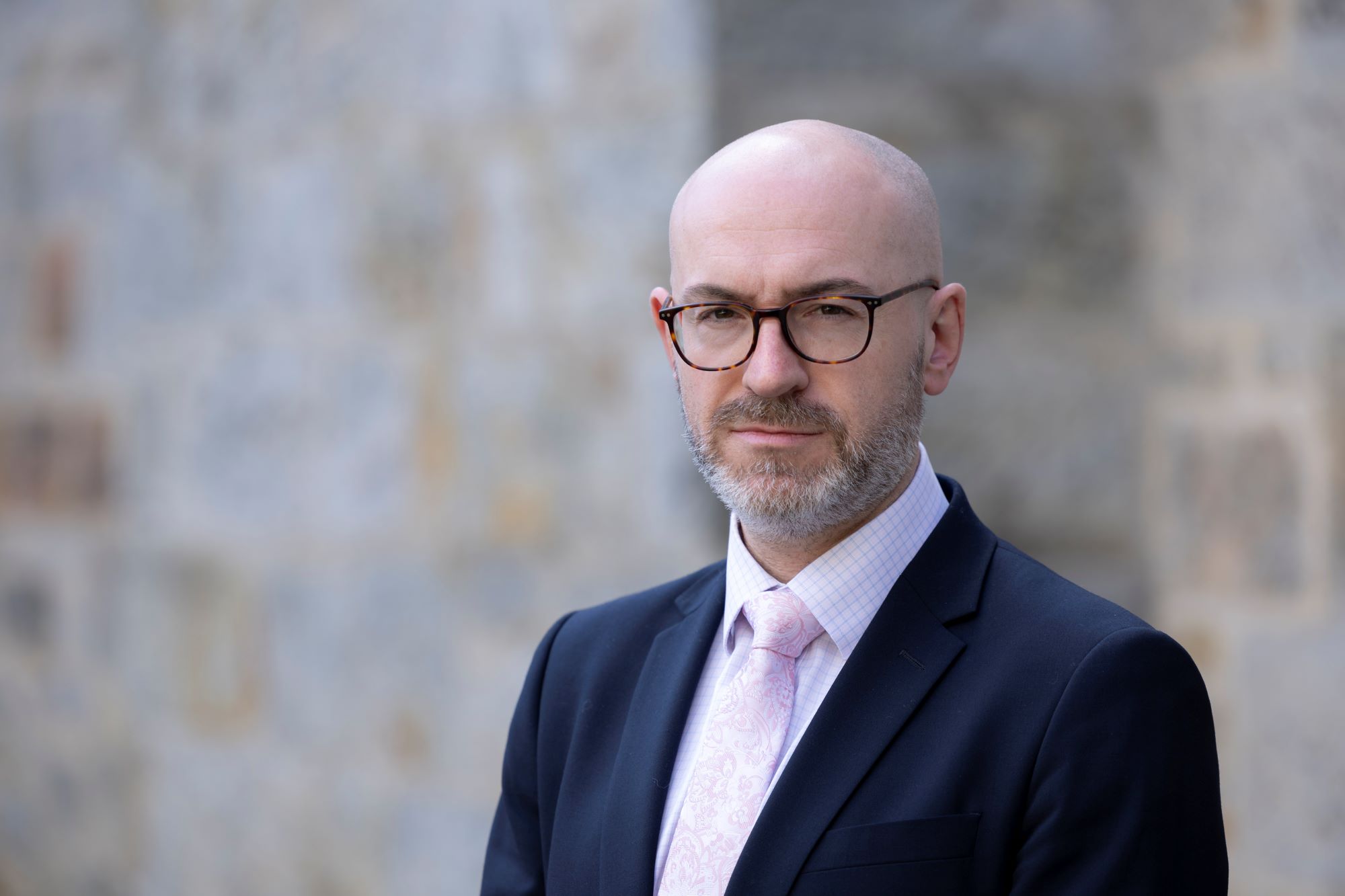 Head and shoulder image of Chris Brown, Deputy Chief Executive of the Scottish Police Authority taken outside.