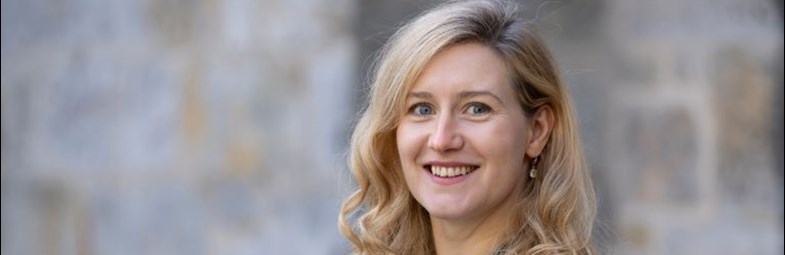 Image of Board Member Katharina Kasper standing outside of an office building.